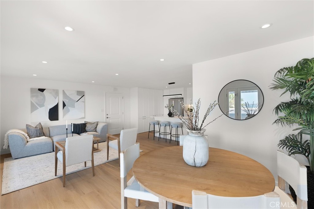 1200 East Ocean Boulevard, Unit 41 Long Beach, CA 90802 - Photo 15 of 35 a living room with furniture a mirror and a clock
