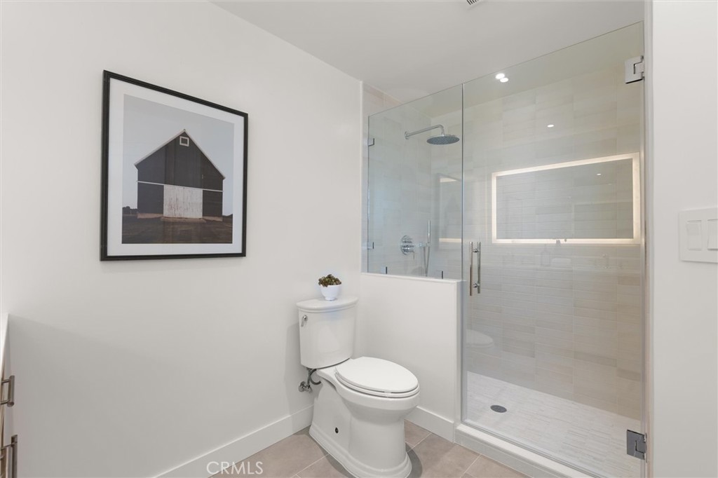 1200 East Ocean Boulevard, Unit 41 Long Beach, CA 90802 - Photo 22 of 35 a white toilet sitting next to a bathroom sink