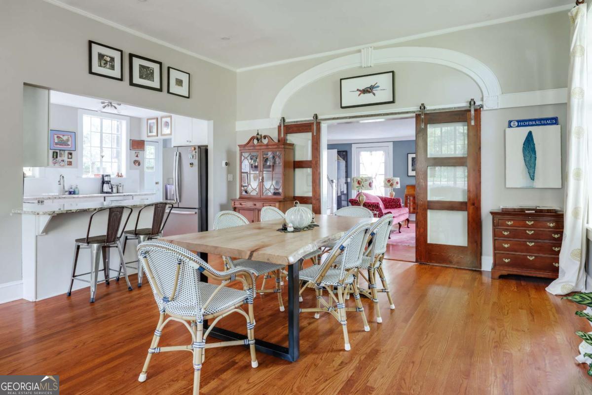 552 Cobb Street Athens, GA 30606 - Photo 11 of 55 a view of a dining room with furniture and wooden floor