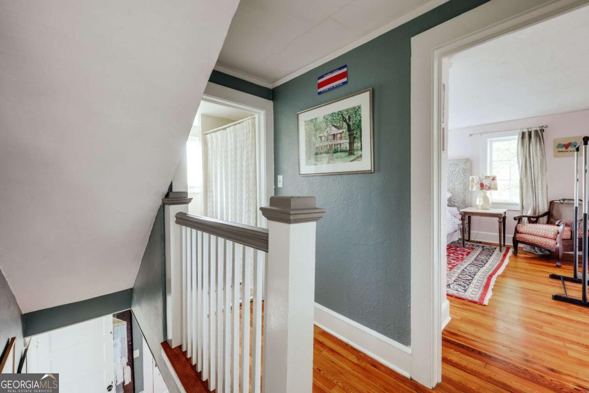 552 Cobb Street Athens, GA 30606 - Photo 22 of 55 a view of a hallway with workspace and wooden floor