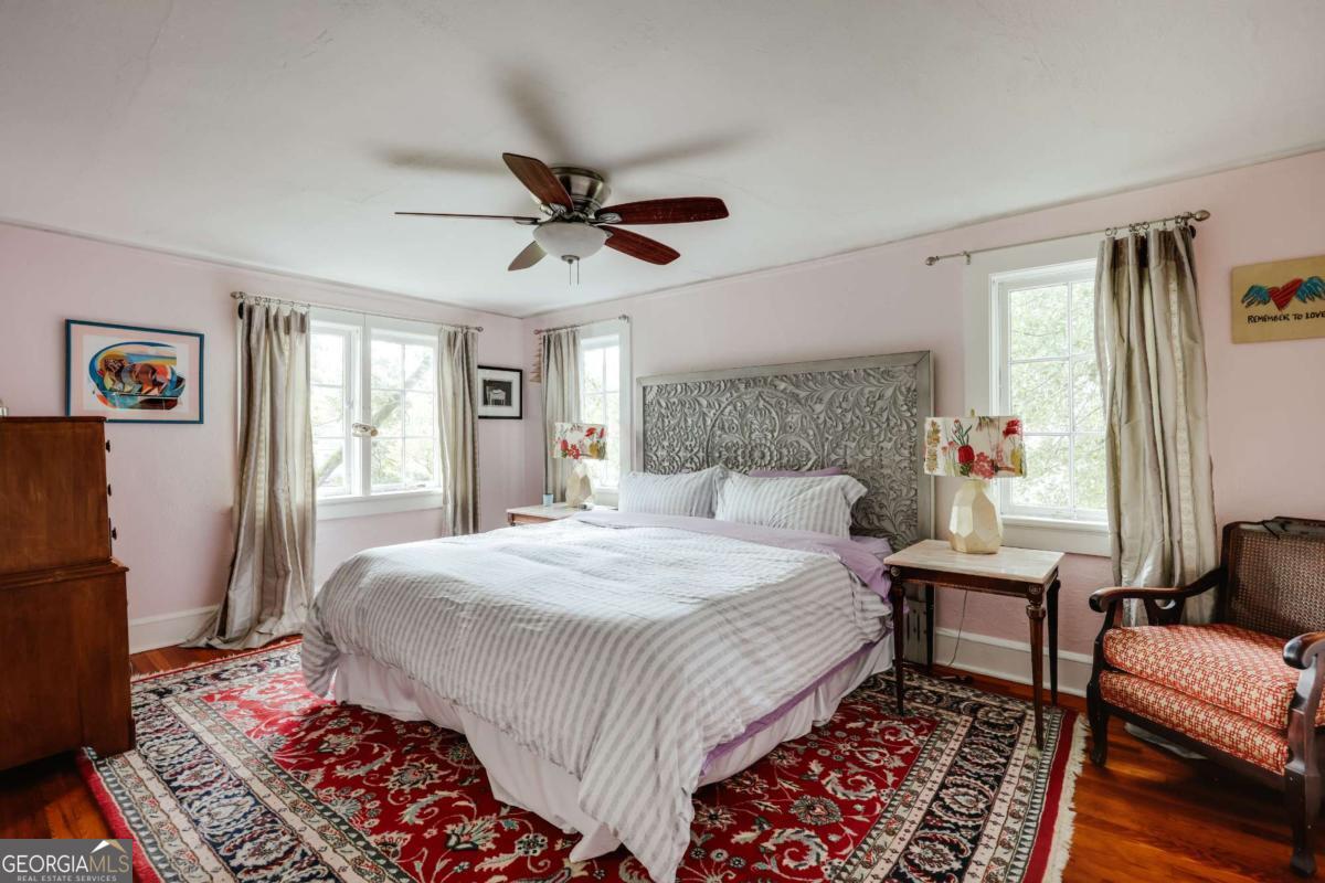 552 Cobb Street Athens, GA 30606 - Photo 23 of 55 a bedroom with a bed couch and a window