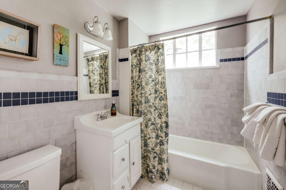 552 Cobb Street Athens, GA 30606 - Photo 37 of 55 a bathroom with a sink a toilet and shower
