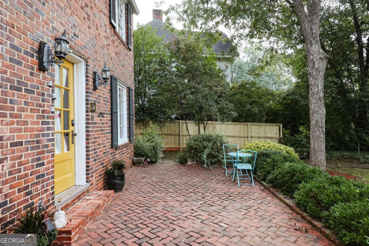 552 Cobb Street Athens, GA 30606 - Photo 46 of 55 a backyard of a house with outdoor seating and plants
