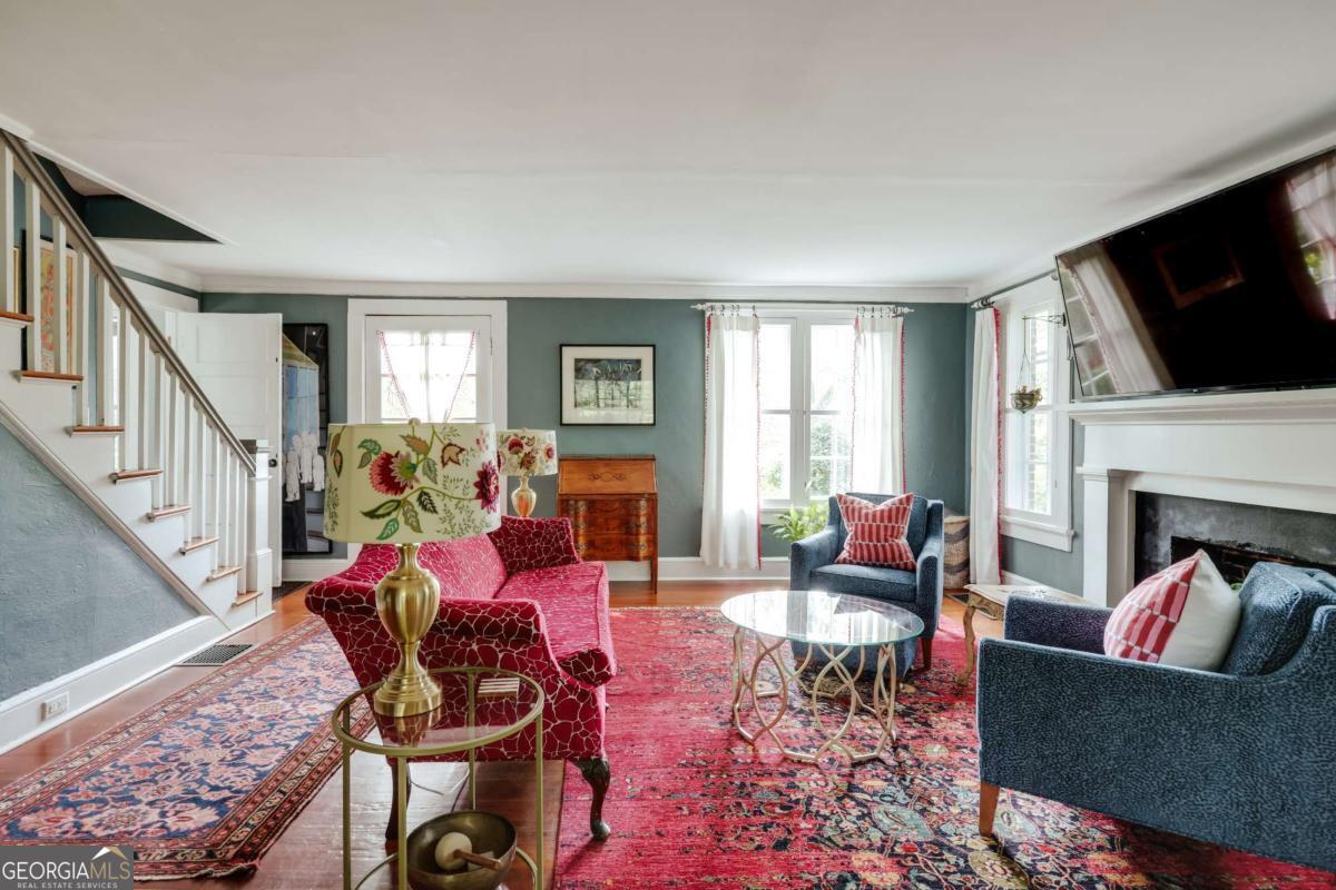 552 Cobb Street Athens, GA 30606 - Photo 9 of 55 a living room with furniture fireplace and flat screen tv
