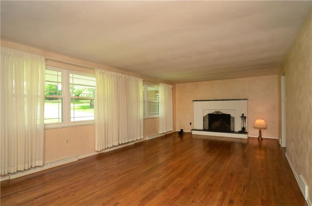 1423 Coraopolis Heights Road Coraopolis, PA 15108 - Photo 10 of 25 Living room - original hardwood floors - log burning fireplace