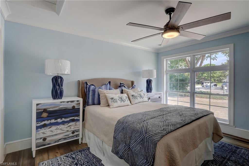 694 Regatta Court Naples, FL 34103 - Photo 24 of 33 a bedroom with a bed and a large window