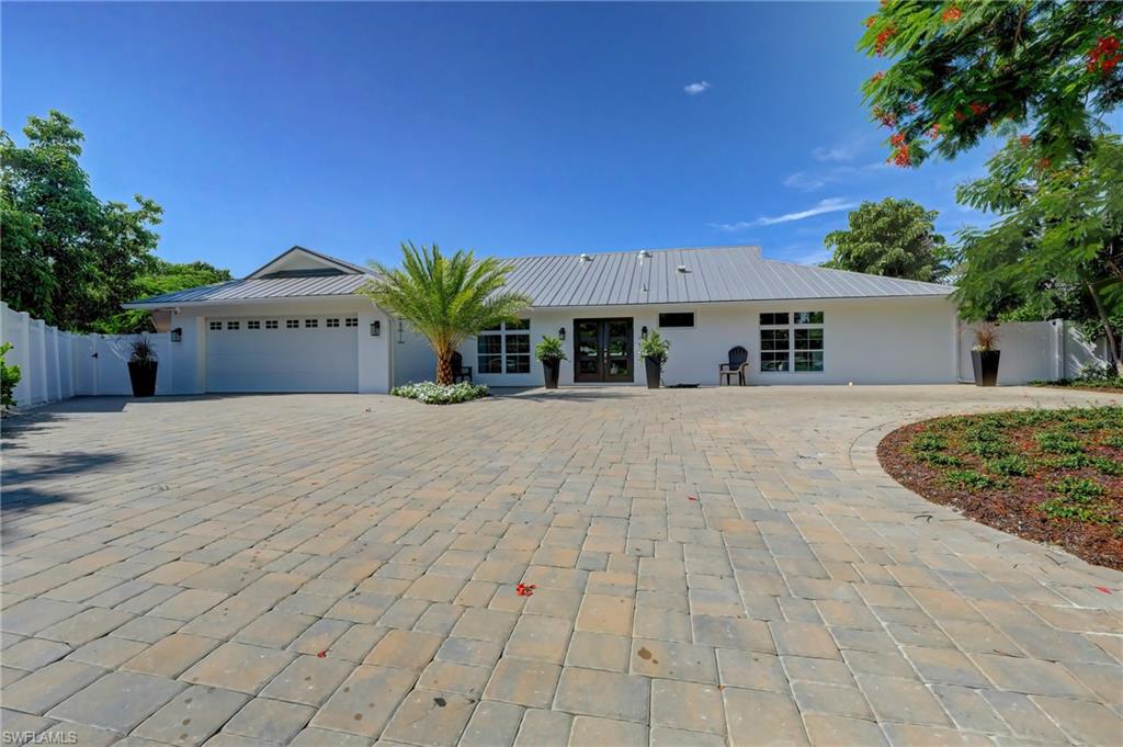 694 Regatta Court Naples, FL 34103 - Photo 32 of 33 a view of a house with a patio