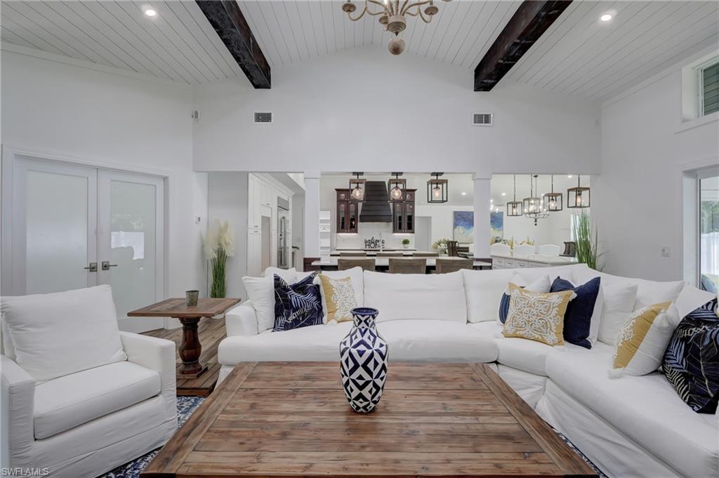 694 Regatta Court Naples, FL 34103 - Photo 6 of 33 a living room with furniture and kitchen view