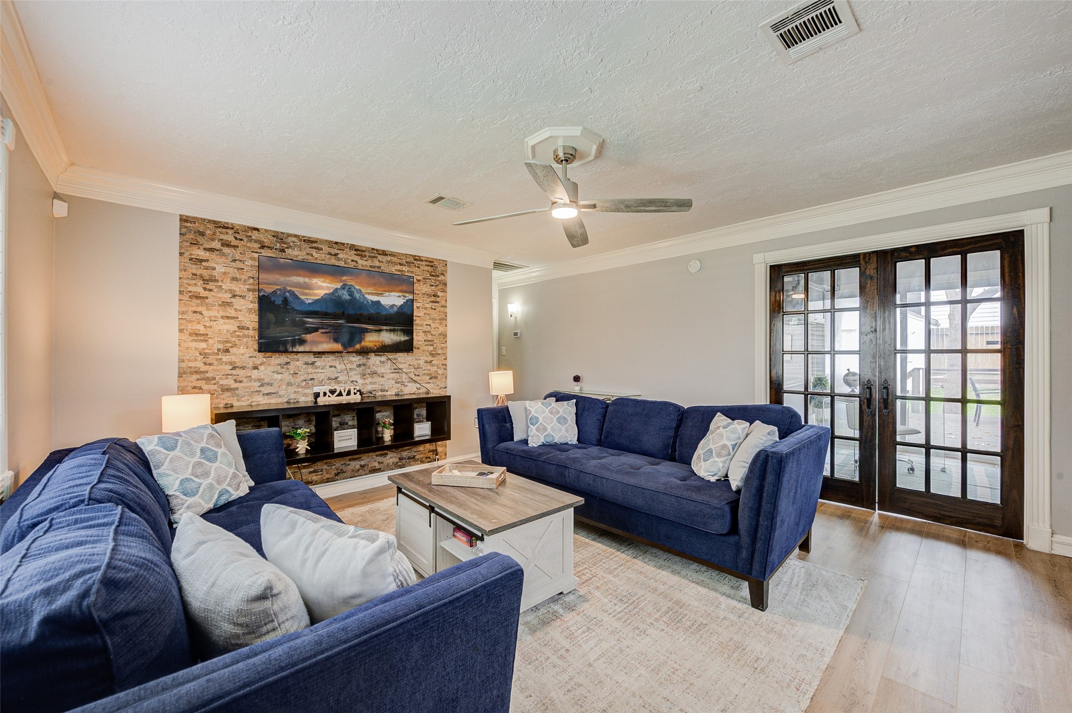 1207 Archer Street Houston, TX 77009 - Photo 18 of 30 a living room with fireplace furniture and a flat screen tv