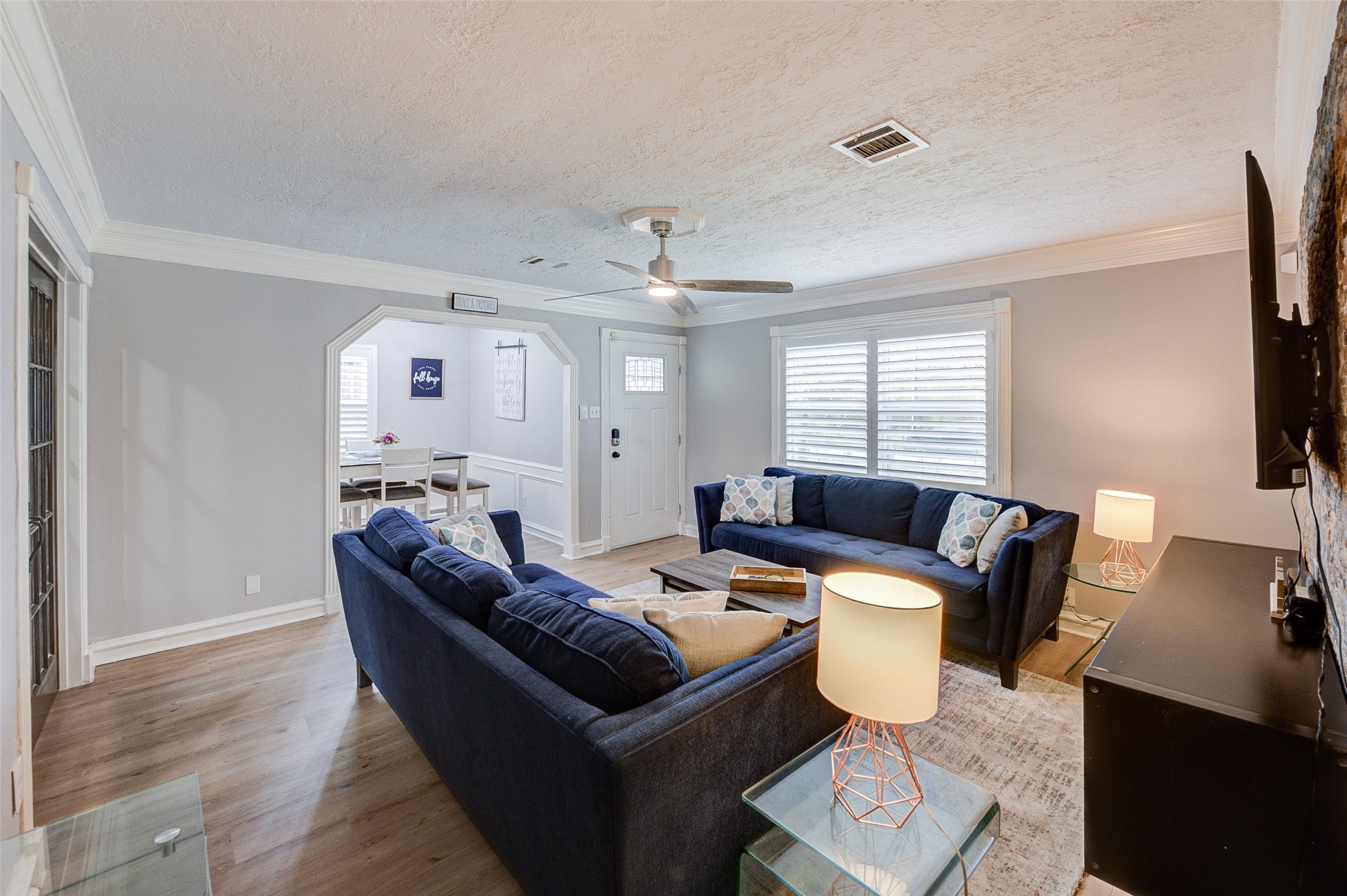 1207 Archer Street Houston, TX 77009 - Photo 19 of 30 a living room with furniture and a flat screen tv