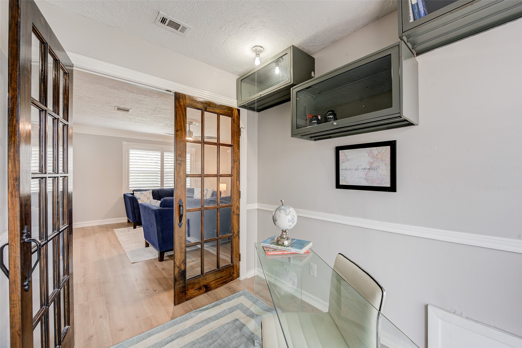 1207 Archer Street Houston, TX 77009 - Photo 22 of 30 a living room with furniture a flat screen tv and a refrigerator