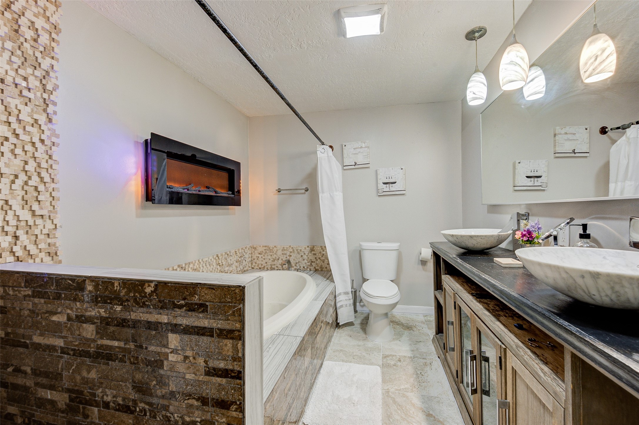 1207 Archer Street Houston, TX 77009 - Photo 24 of 30 a bathroom with a granite countertop sink a toilet a mirror and vanity