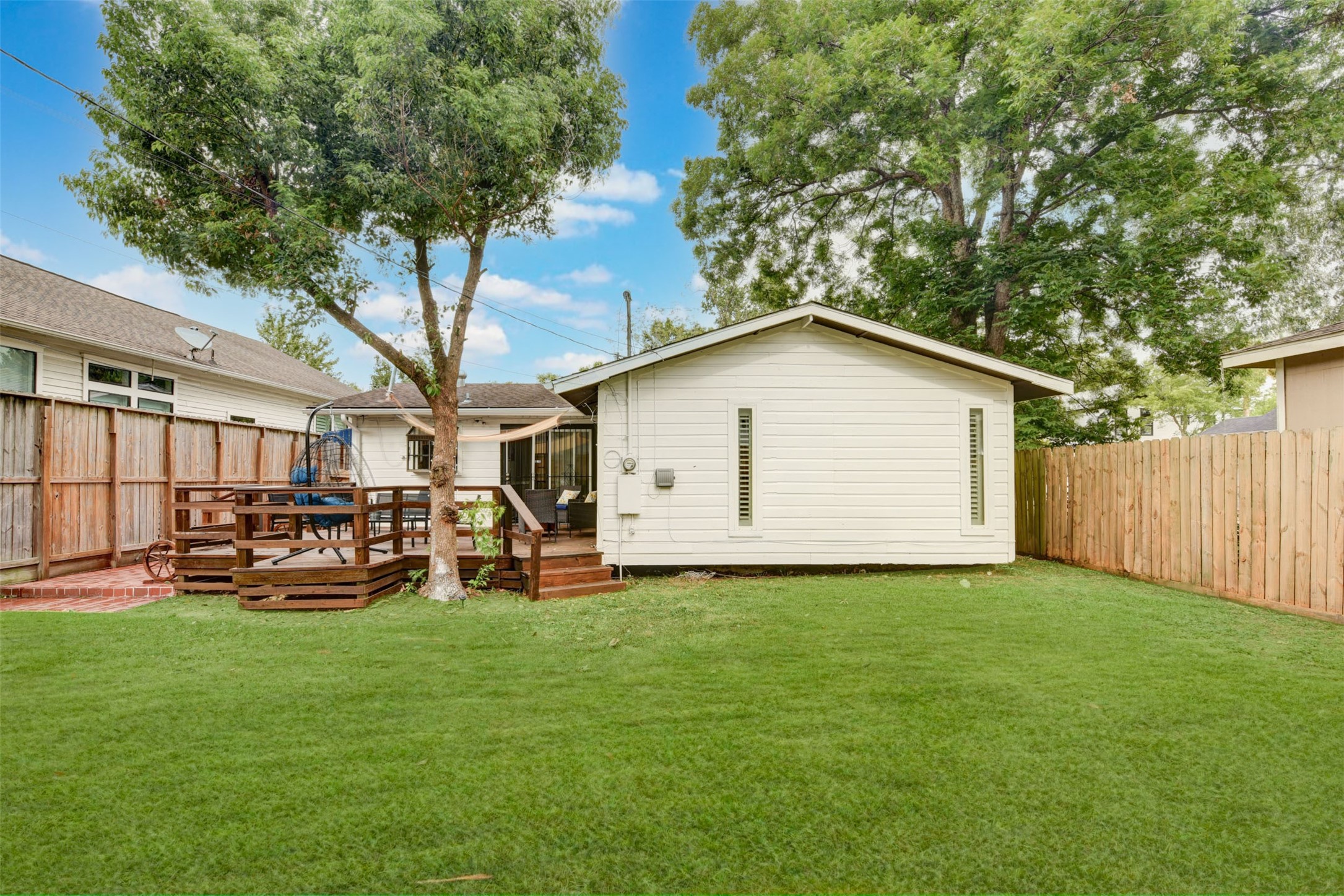 1207 Archer Street Houston, TX 77009 - Photo 30 of 30 a view of a backyard with a sitting area and slide
