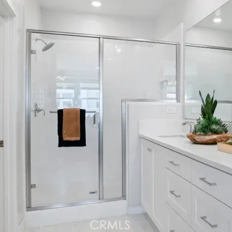a bathroom with a shower and a sink