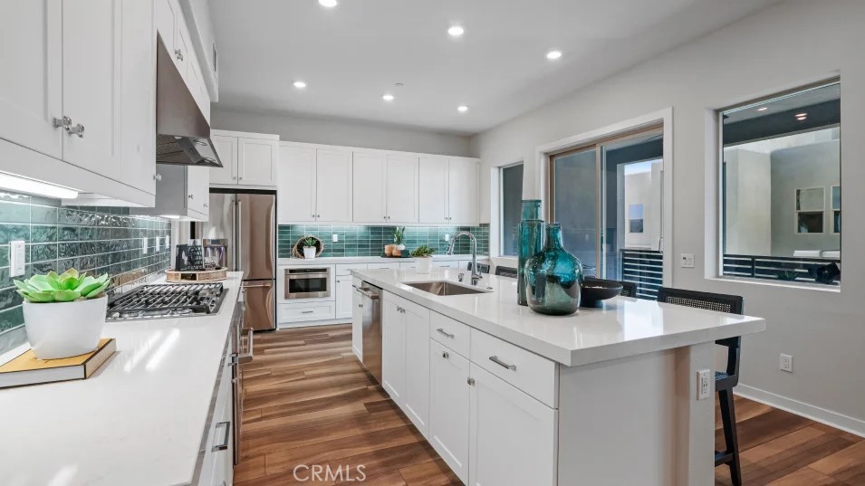 1005 Walnut Terrace Montebello, CA 90640 - Photo 2 of 37 a kitchen with stainless steel appliances a sink stove and cabinets