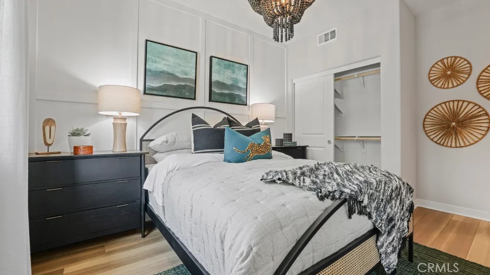 1005 Walnut Terrace Montebello, CA 90640 - Photo 26 of 37 a bedroom with a bed and a chandelier