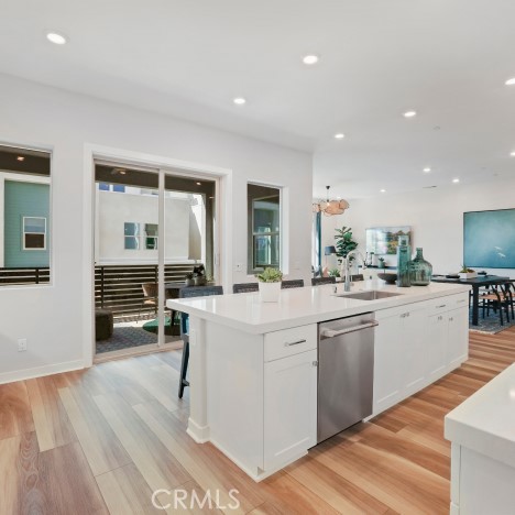 1005 Walnut Terrace Montebello, CA 90640 - Photo 5 of 37 a kitchen with white cabinets and sink