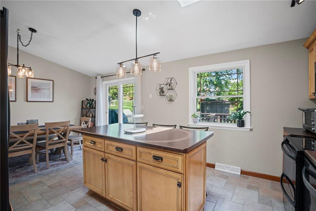 56 Regola Drive Irwin, PA 15642 - Photo 13 of 43 a kitchen with appliances a sink a table and chairs in it