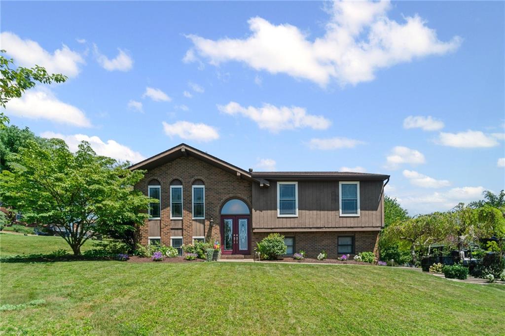 56 Regola Drive Irwin, PA 15642 - Photo 2 of 43 a front view of a house with a yard