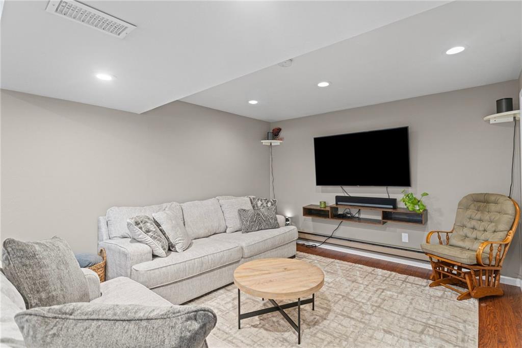 56 Regola Drive Irwin, PA 15642 - Photo 23 of 43 a living room with furniture and a flat screen tv