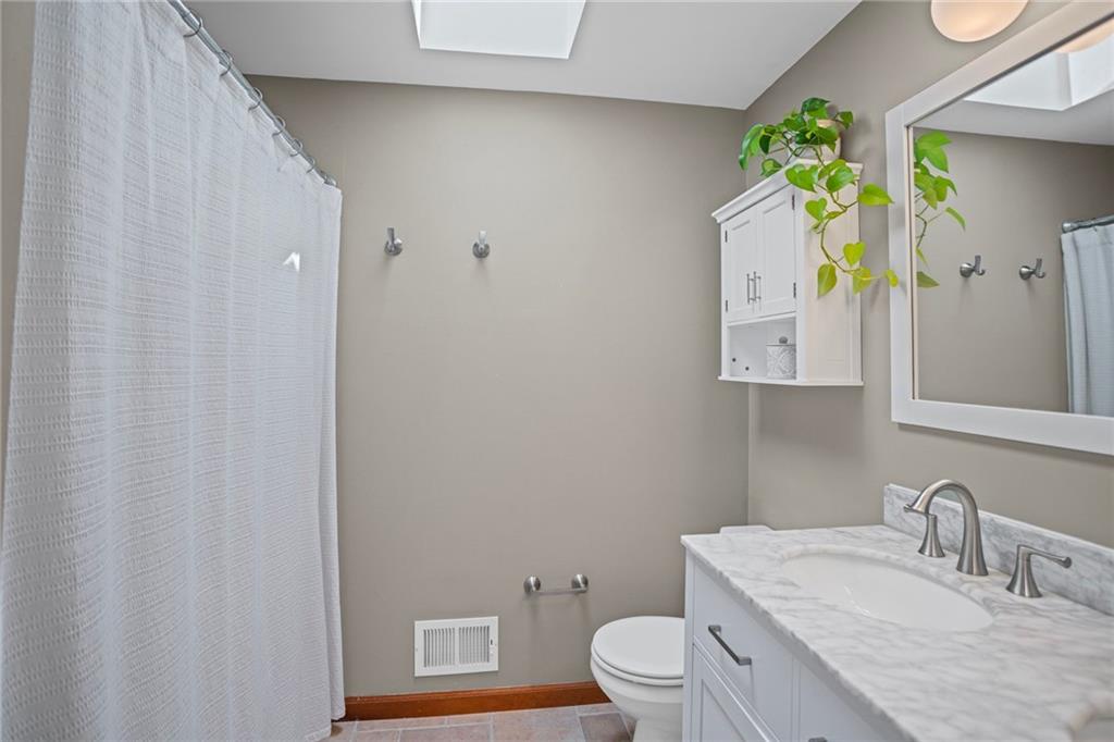 56 Regola Drive Irwin, PA 15642 - Photo 24 of 43 a bathroom with a granite countertop toilet sink and mirror