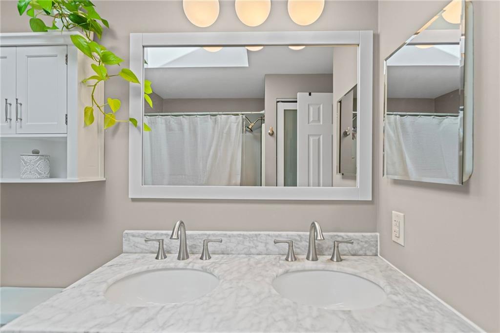 56 Regola Drive Irwin, PA 15642 - Photo 25 of 43 a bathroom with a sink and a mirror