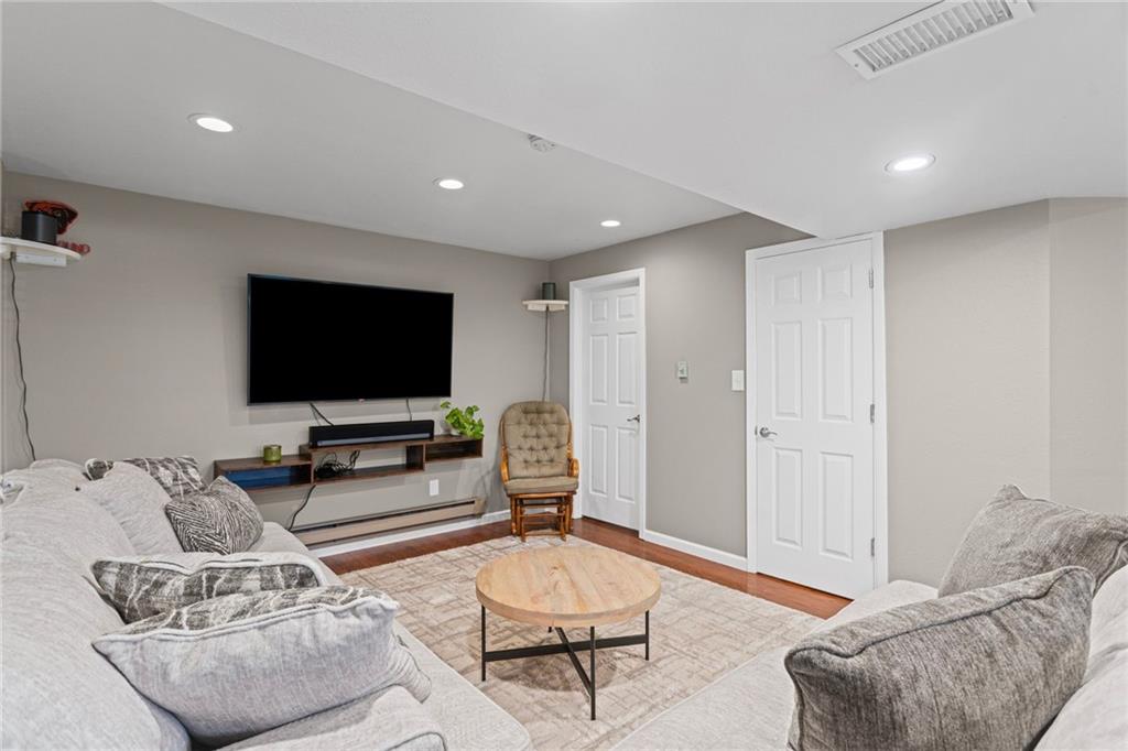 56 Regola Drive Irwin, PA 15642 - Photo 31 of 43 a living room with furniture and a flat screen tv