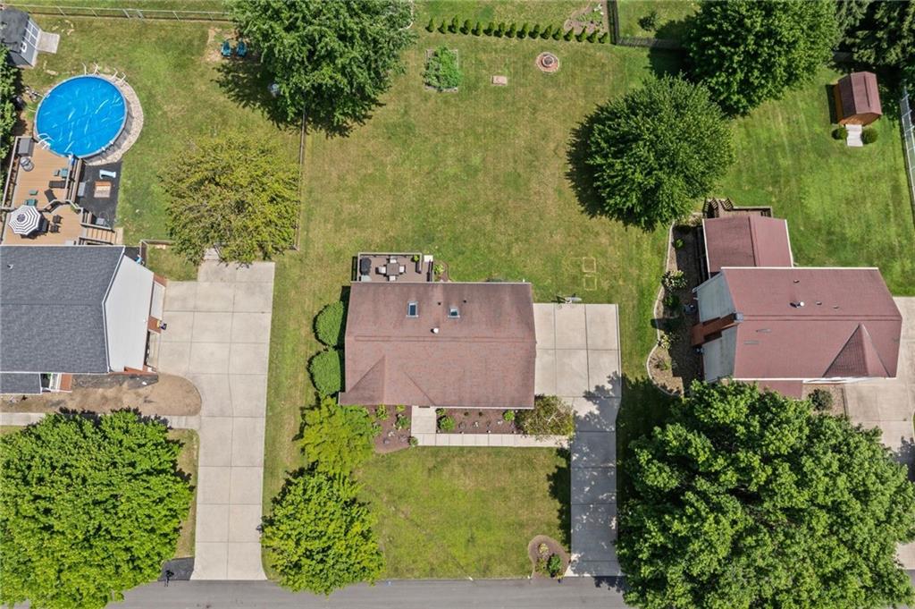 56 Regola Drive Irwin, PA 15642 - Photo 40 of 43 an aerial view of a house with a swimming pool yard and outdoor seating