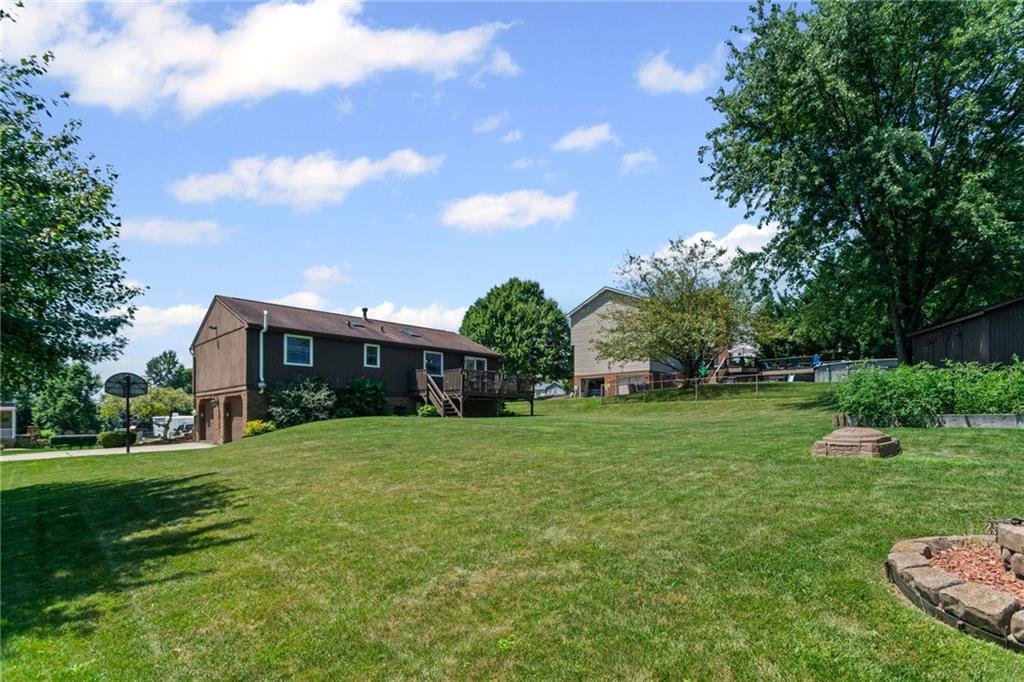 56 Regola Drive Irwin, PA 15642 - Photo 41 of 43 a view of a house with a big yard potted plants and large tree