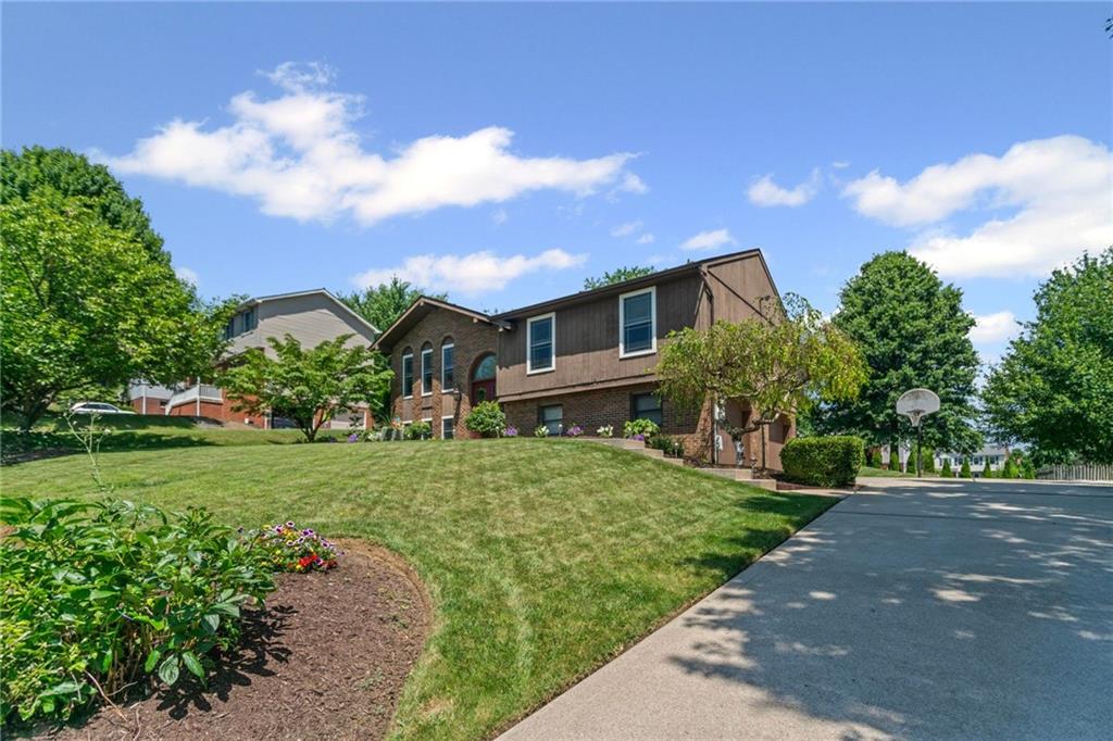 56 Regola Drive Irwin, PA 15642 - Photo 42 of 43 a front view of a house with a yard