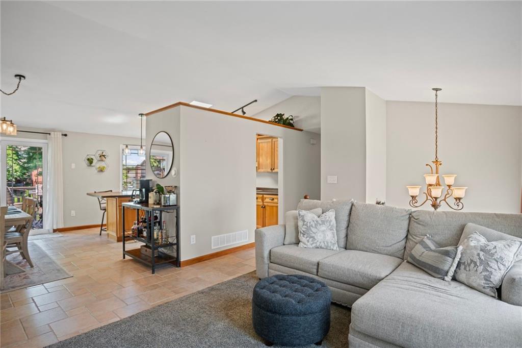 56 Regola Drive Irwin, PA 15642 - Photo 6 of 43 a living room with furniture and a chandelier