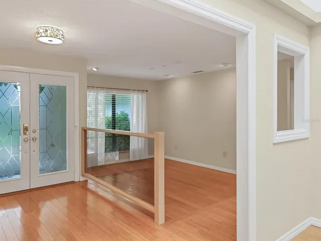 a view of an empty room with glass door