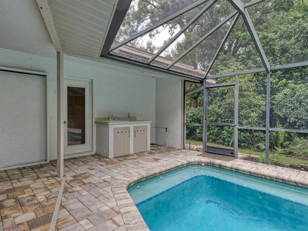 a swimming pool with a outdoor seating