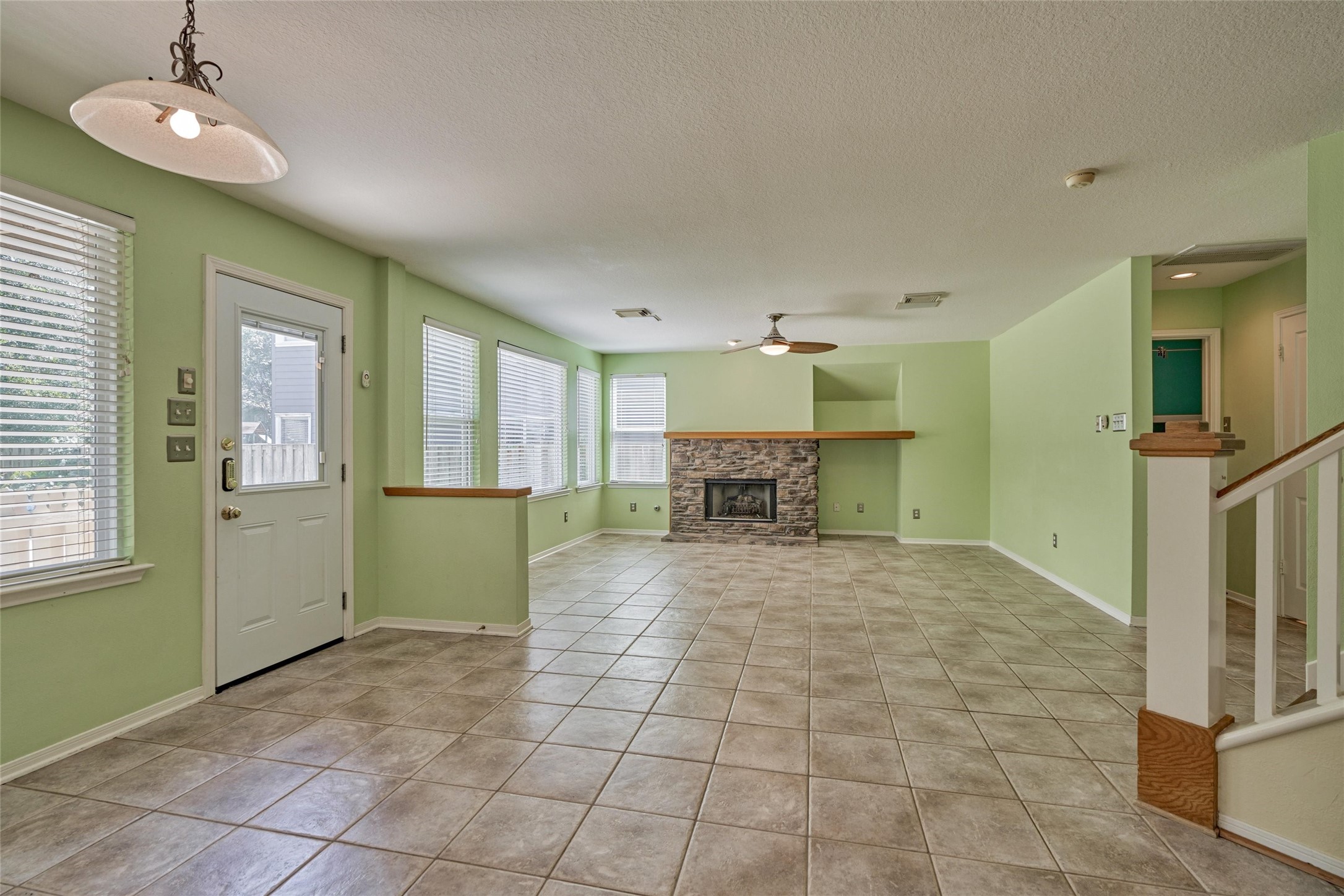 59 West Gaslight Place Spring, TX 77382 - Photo 13 of 47 Interior now painted wihite. View from kitchen into Breakfast area and Family room.