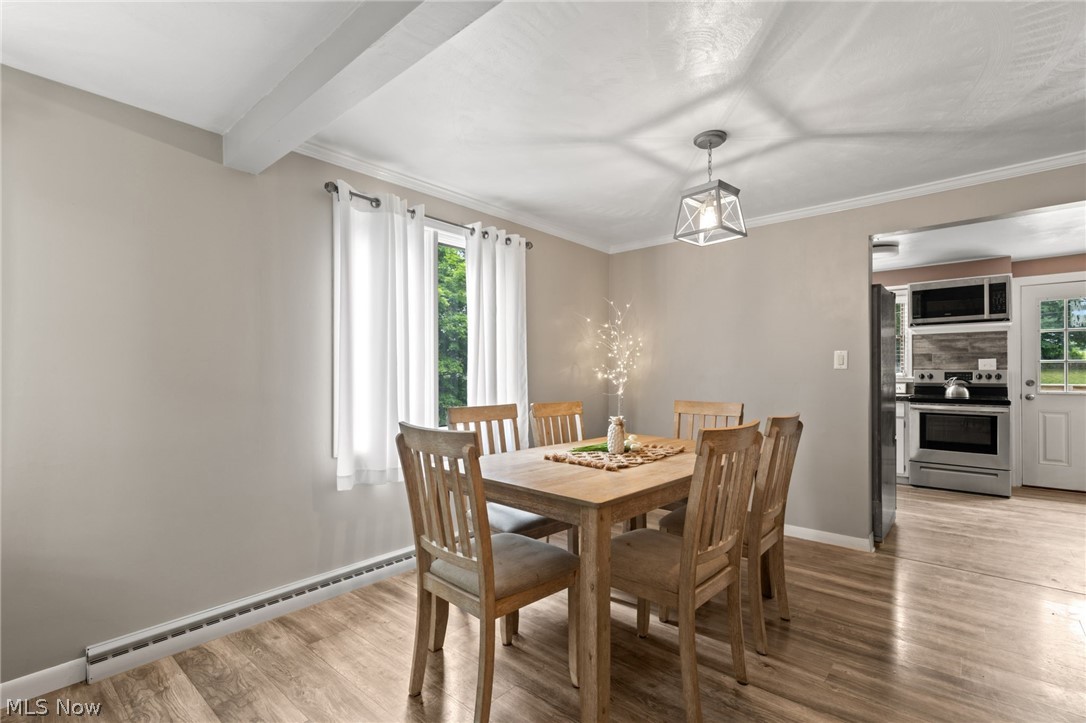 3833 Bellville North Road Bellville, OH 44813 - Photo 4 of 24 Dining room with a healthy amount of sunlight, light hardwood / wood-style flooring, and baseboard heating