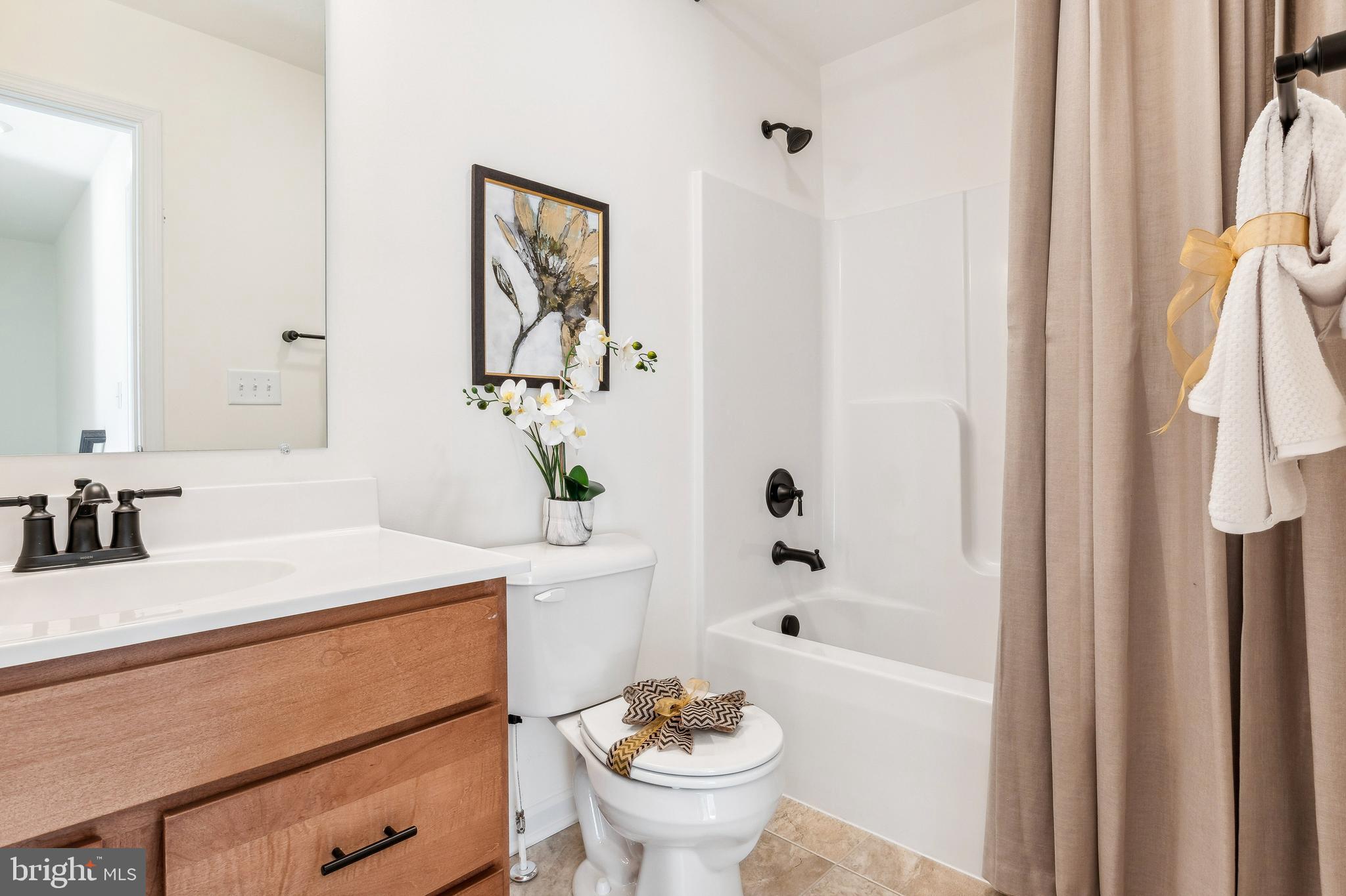 2601 Village Road Dover, PA 17315 - Photo 17 of 20 a bathroom with a sink a toilet and a bathtub