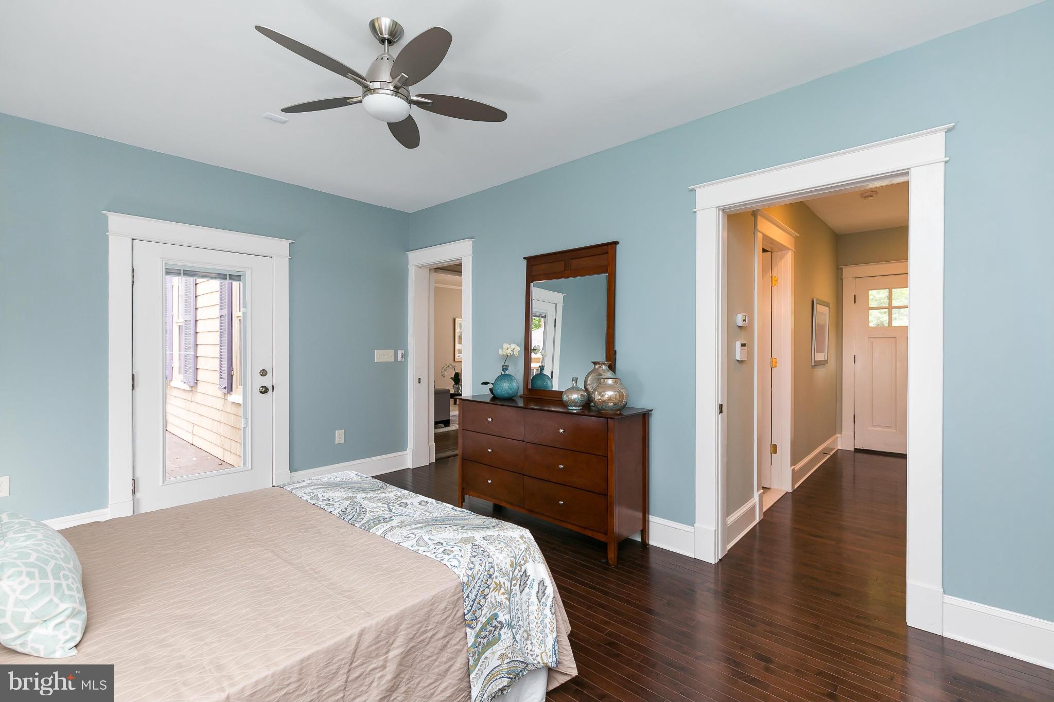 2306 Ken Oak Road Baltimore, MD 21209 - Photo 14 of 30 a bedroom with a bed and a dresser
