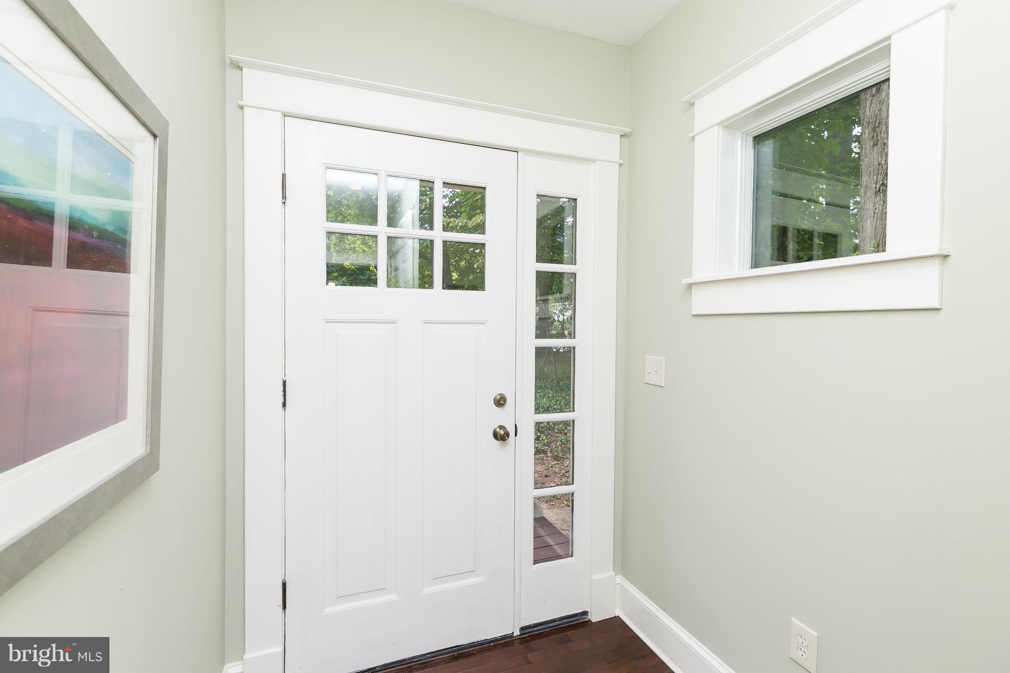 2306 Ken Oak Road Baltimore, MD 21209 - Photo 16 of 30 an entryway with wooden floor and windows