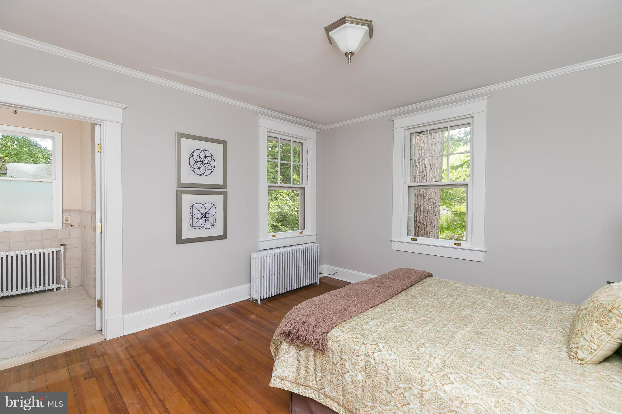 2306 Ken Oak Road Baltimore, MD 21209 - Photo 18 of 30 a bedroom with a bed and a window
