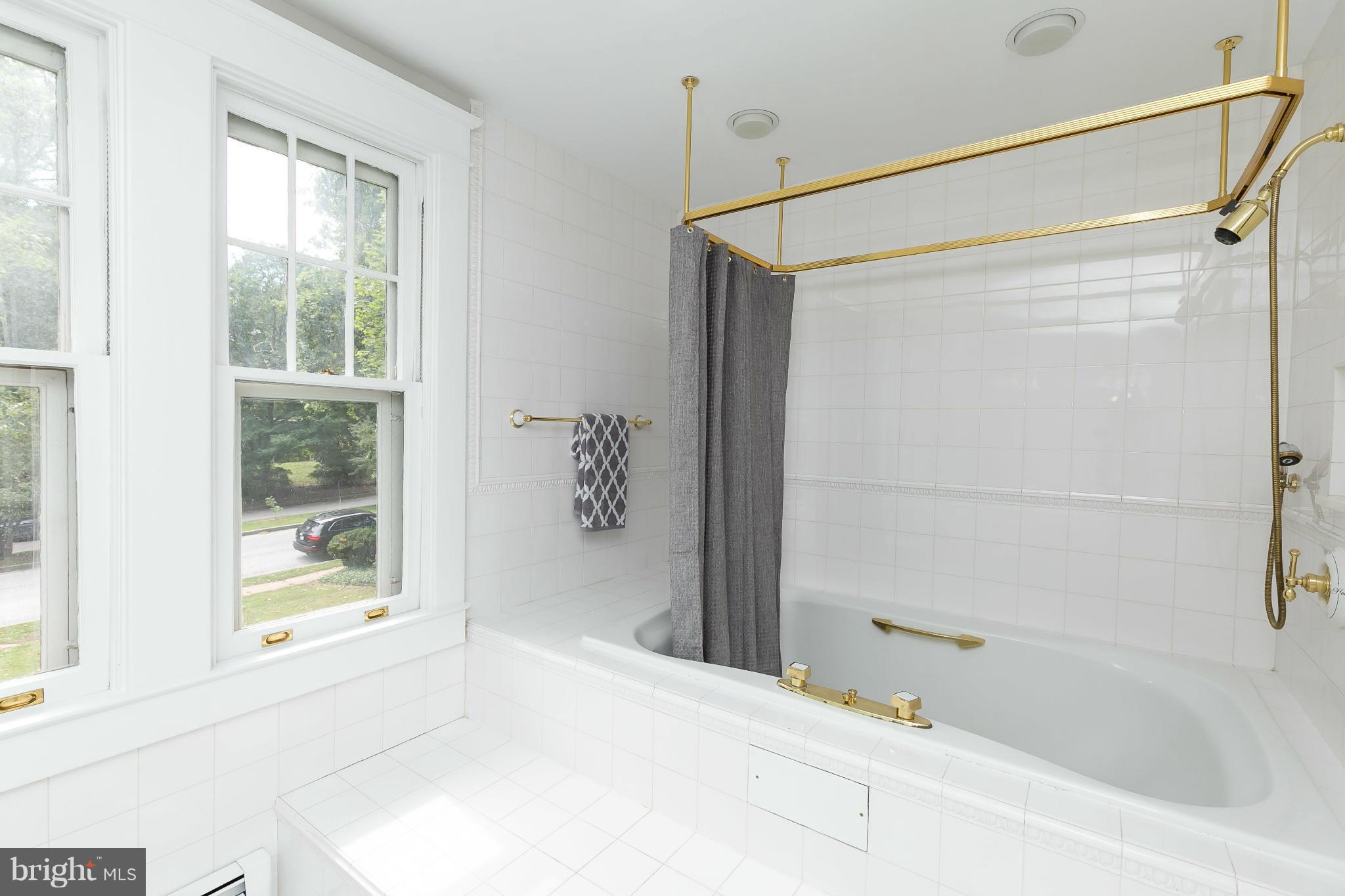 2306 Ken Oak Road Baltimore, MD 21209 - Photo 22 of 30 a bathroom with a bathtub and a shower