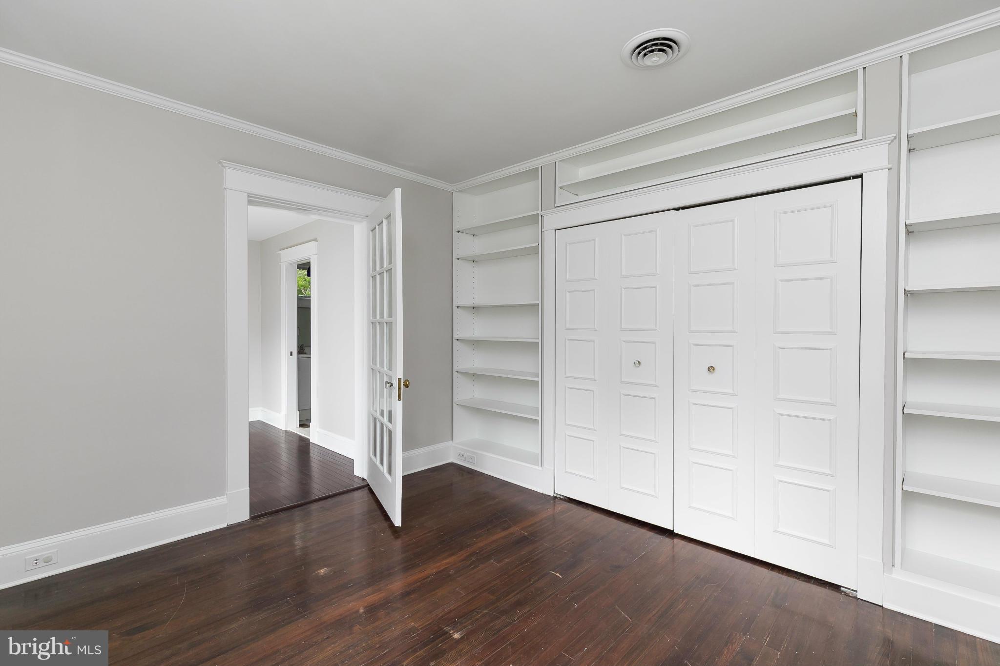 2306 Ken Oak Road Baltimore, MD 21209 - Photo 24 of 30 a view of an empty room with wooden floor and closet