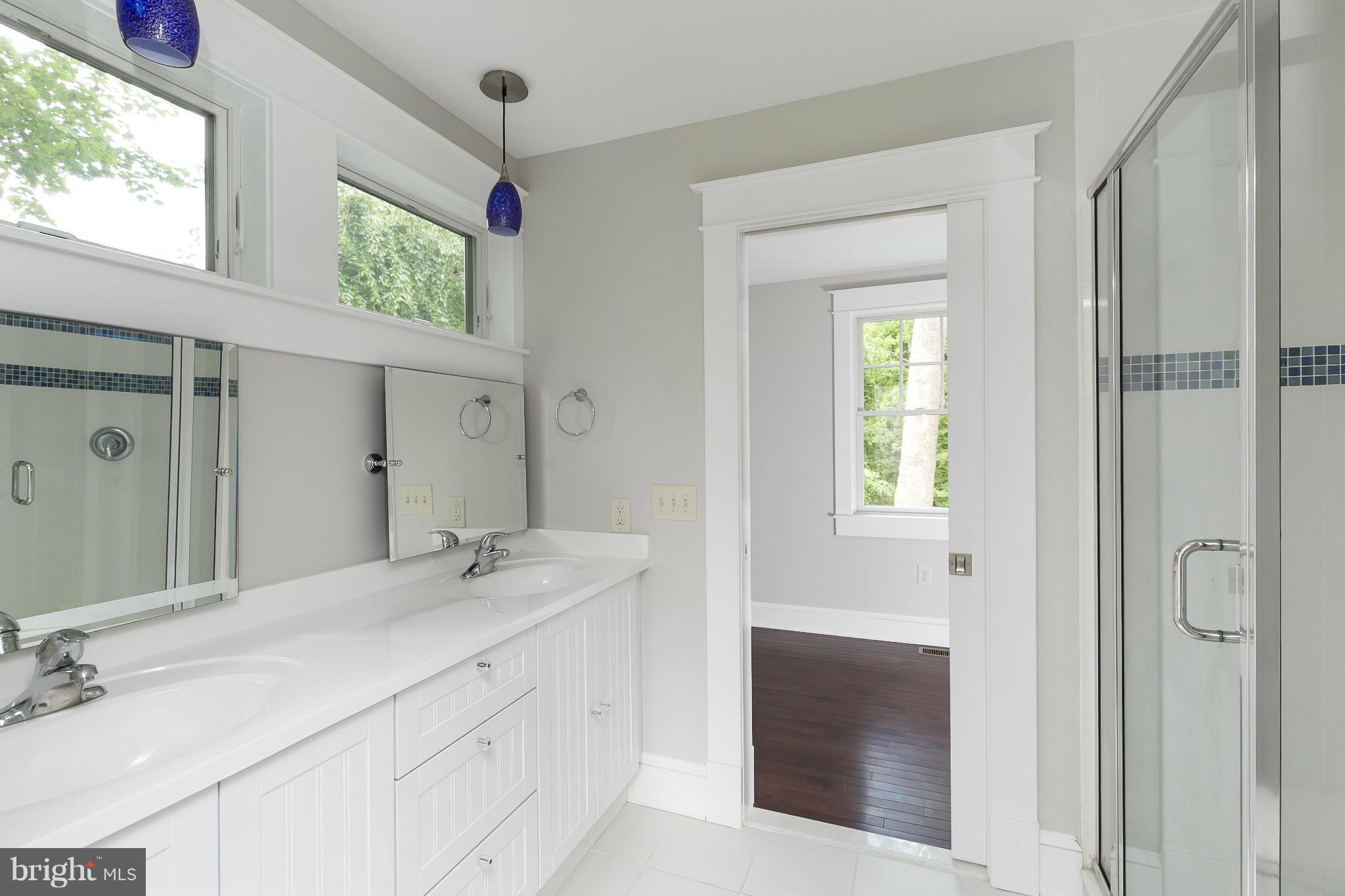 2306 Ken Oak Road Baltimore, MD 21209 - Photo 25 of 30 a bathroom with a sink vanity and a mirror