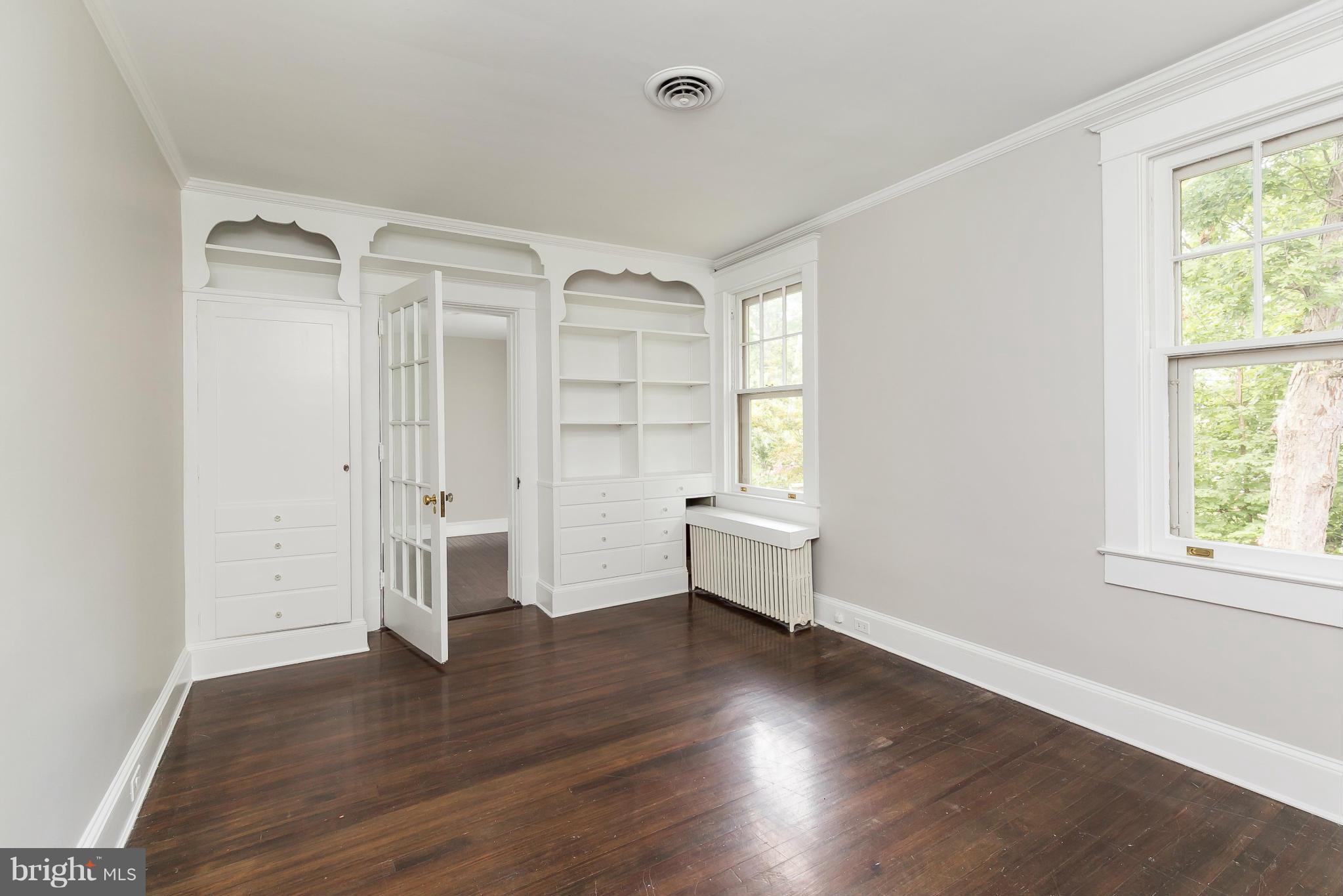 2306 Ken Oak Road Baltimore, MD 21209 - Photo 26 of 30 a view of empty room with wooden floor and fan