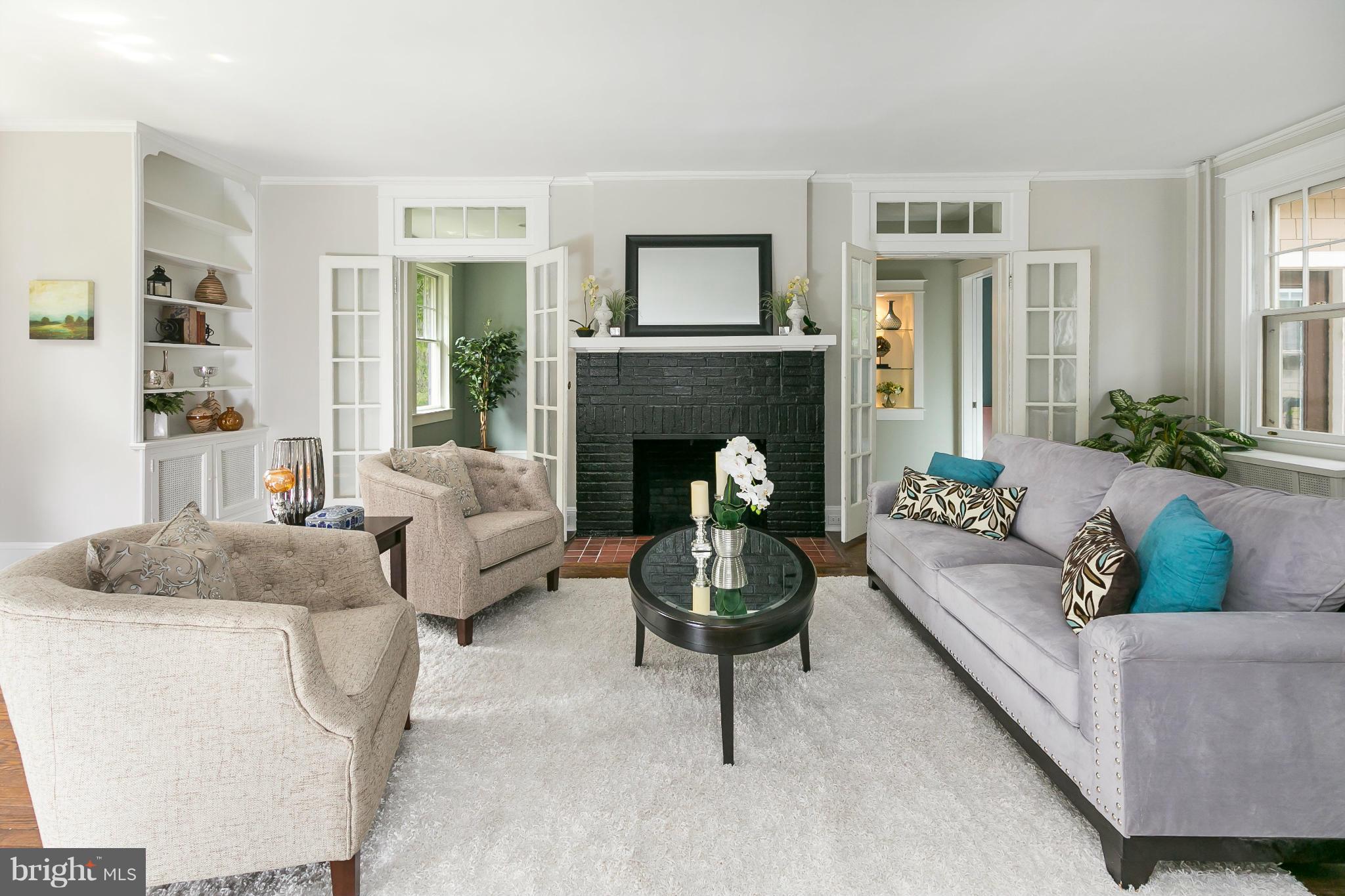 2306 Ken Oak Road Baltimore, MD 21209 - Photo 4 of 30 a living room with furniture and a fireplace