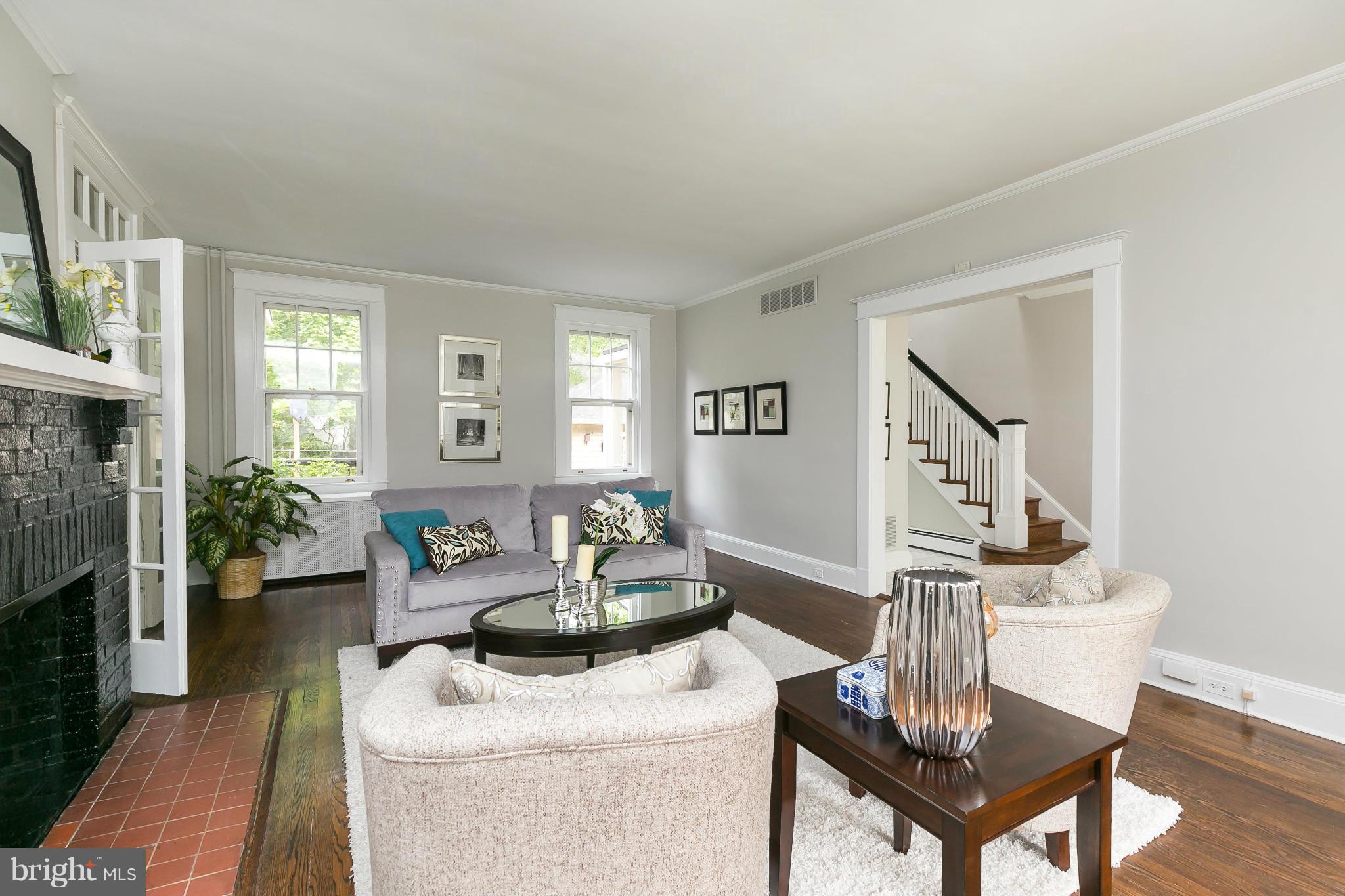 2306 Ken Oak Road Baltimore, MD 21209 - Photo 5 of 30 a living room with furniture and a fireplace