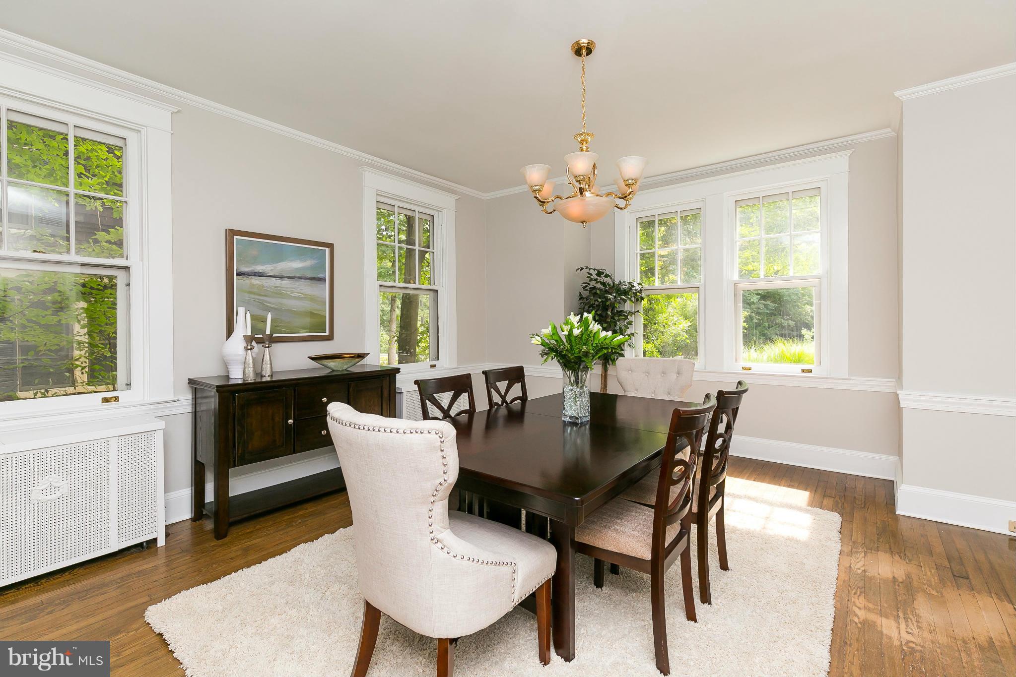2306 Ken Oak Road Baltimore, MD 21209 - Photo 7 of 30 a view of a dining room with furniture window and wooden floor