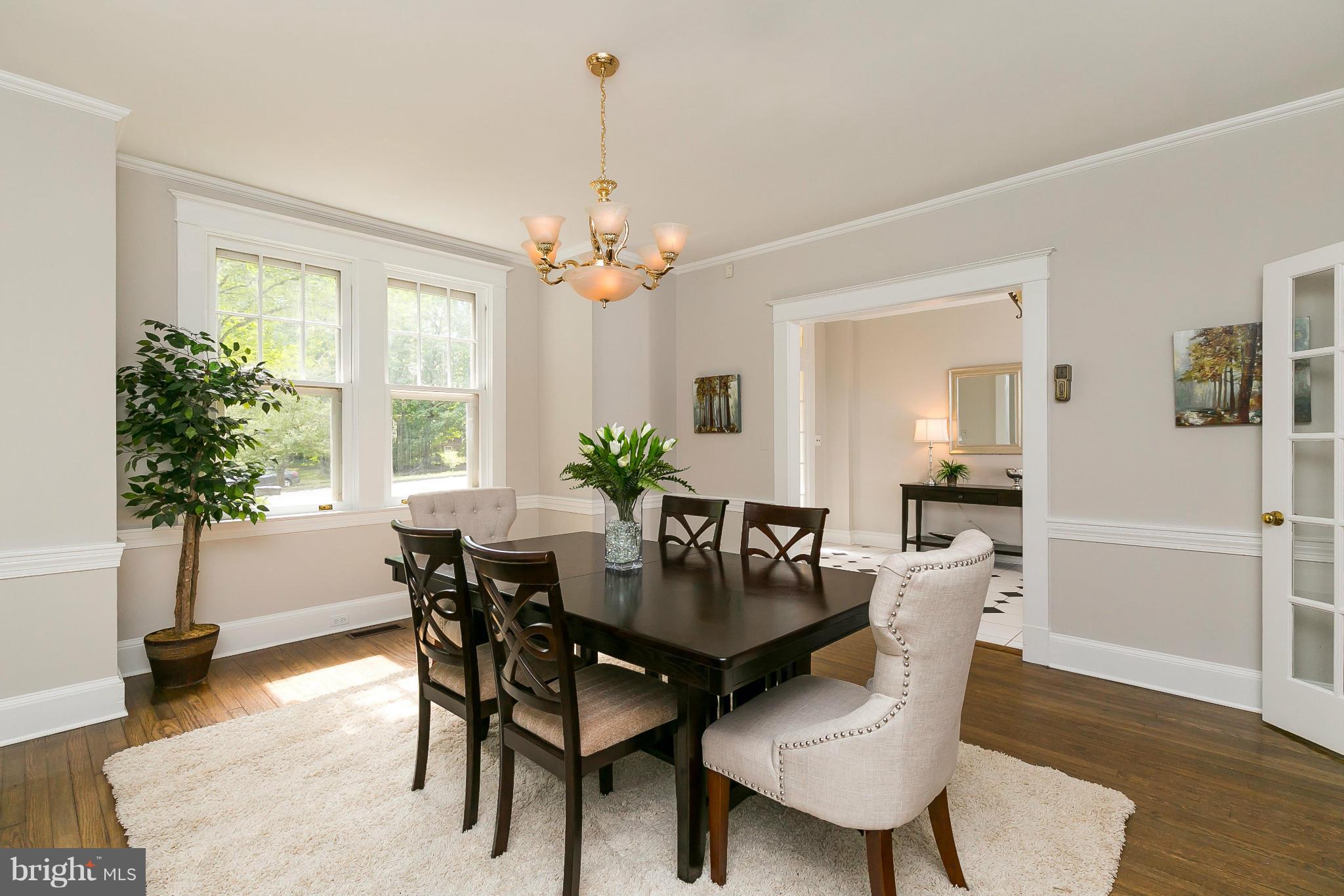 2306 Ken Oak Road Baltimore, MD 21209 - Photo 8 of 30 a view of a dining room with furniture window and wooden floor