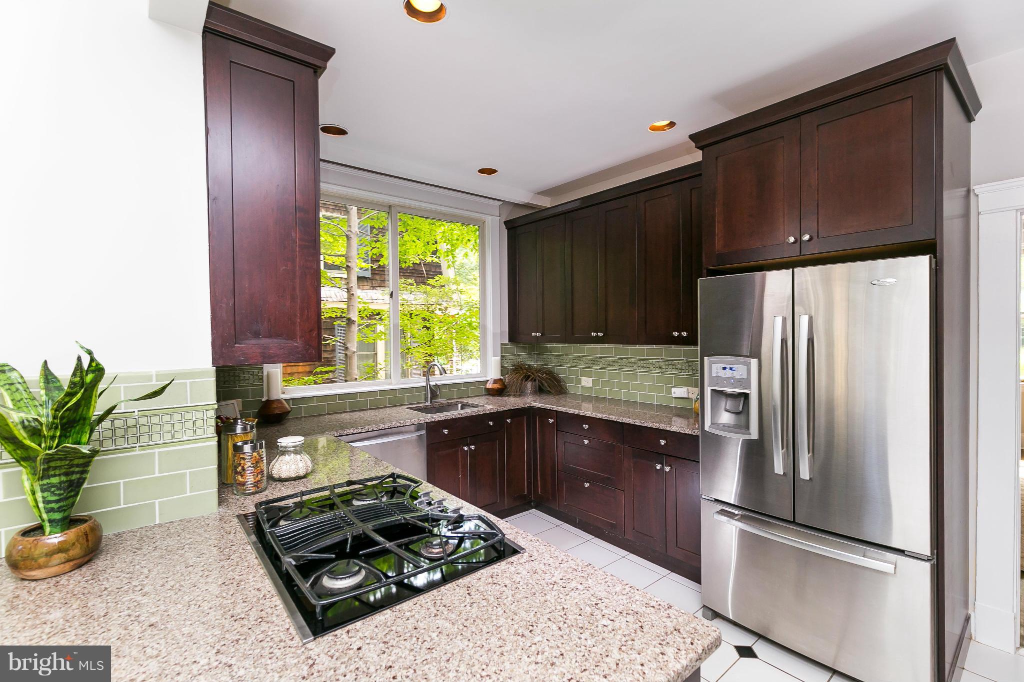 2306 Ken Oak Road Baltimore, MD 21209 - Photo 9 of 30 a kitchen with stainless steel appliances granite countertop a refrigerator and a sink