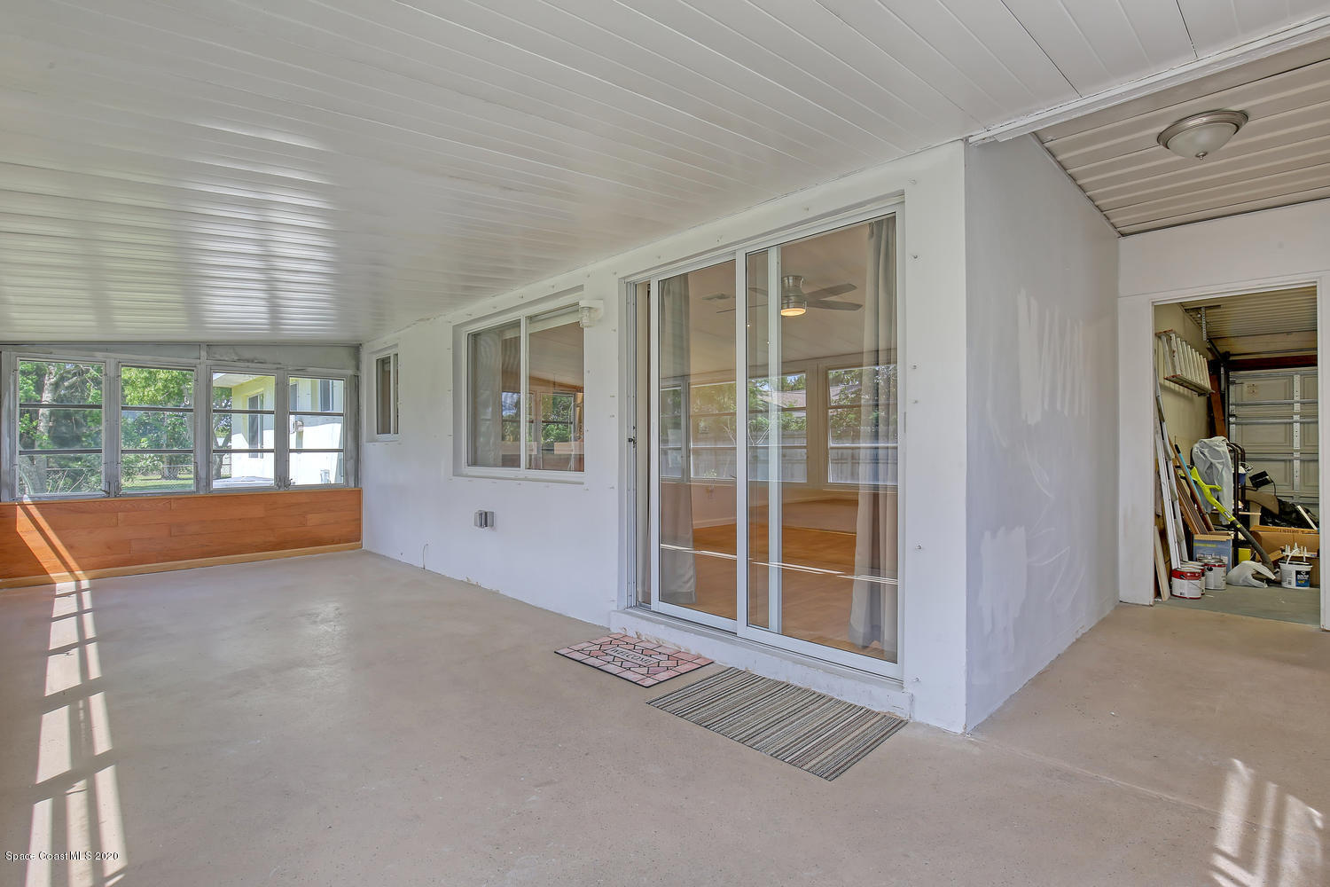 930 Bacon Circle Northeast Palm Bay, FL 32905 - Photo 26 of 33 Path to the garage