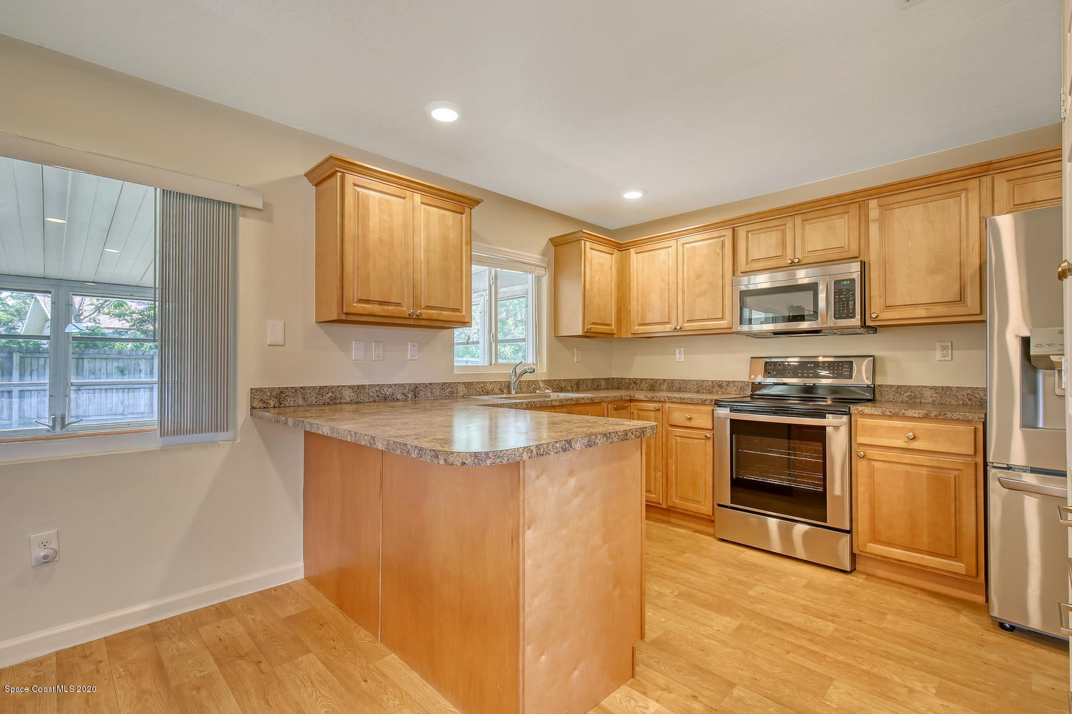 930 Bacon Circle Northeast Palm Bay, FL 32905 - Photo 6 of 33 Kitchen-maple cabinets